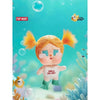 A small orange vinyl figure of a girl with bright yellow hair and pink skin is shown against a blue aquatic background.