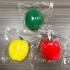 Three plastic bags contain green, yellow, and red bell peppers used as fidget toys