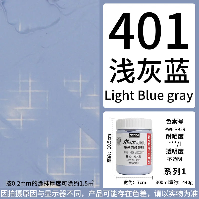 Matte acrylic paint in light blue gray color shown in a professional bottle