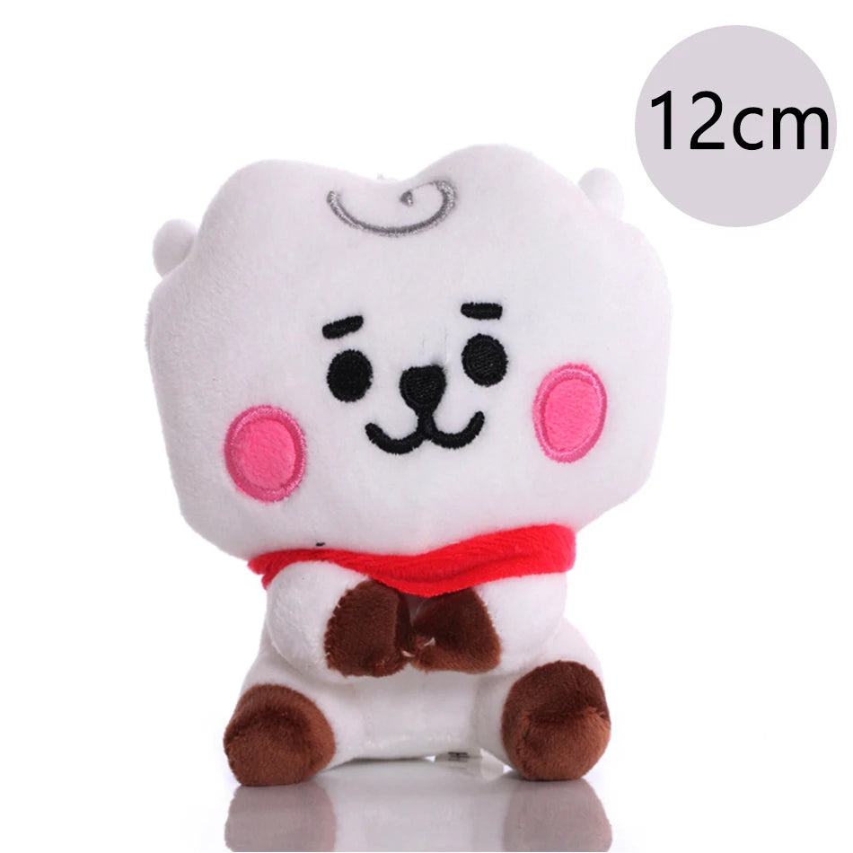 White and brown mini plush keychain of a cute animal character with pink accents
