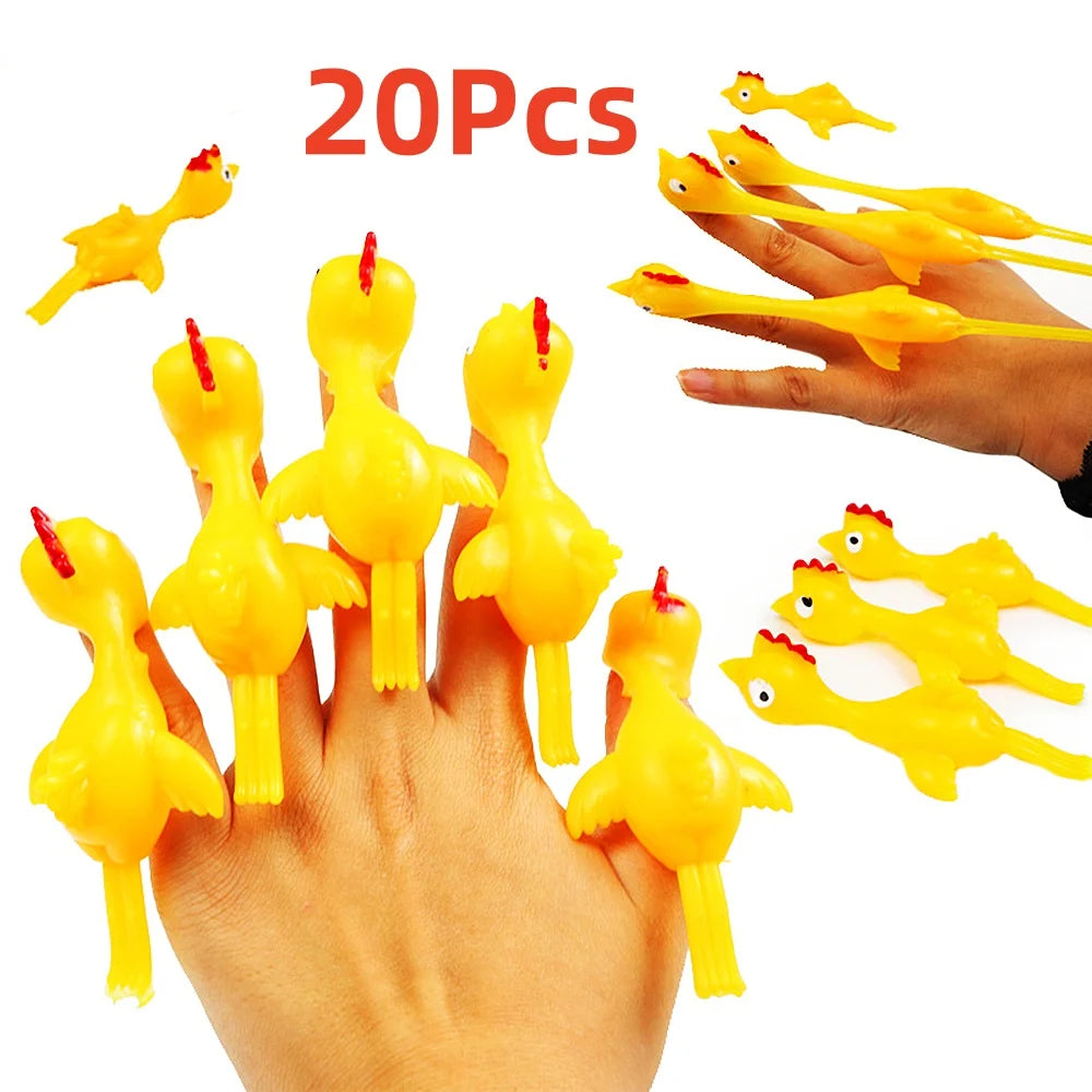 A hand is holding and displaying 20 yellow catapult chicken flying toys.