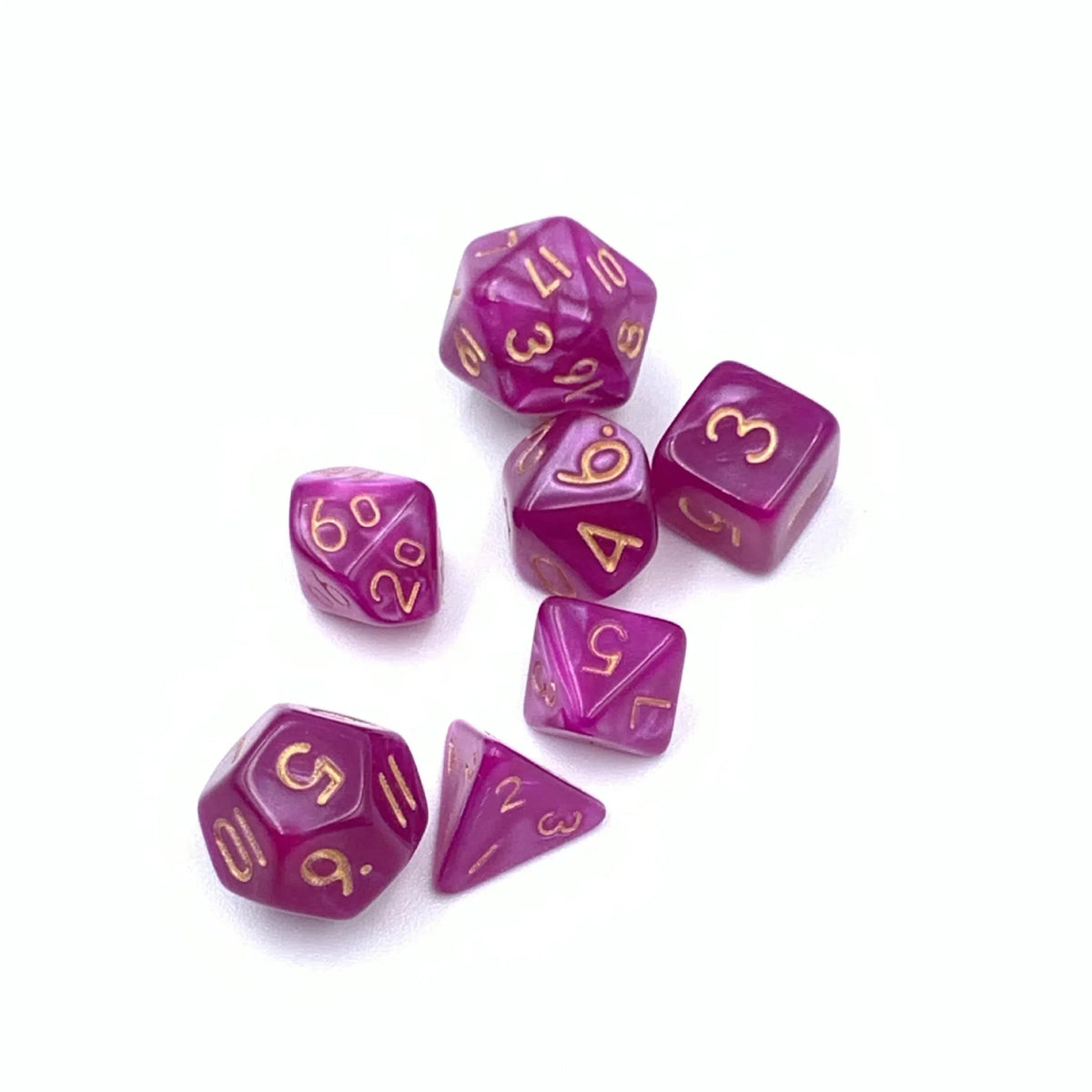 A set of seven small purple polyhedral dice used for tabletop role-playing games