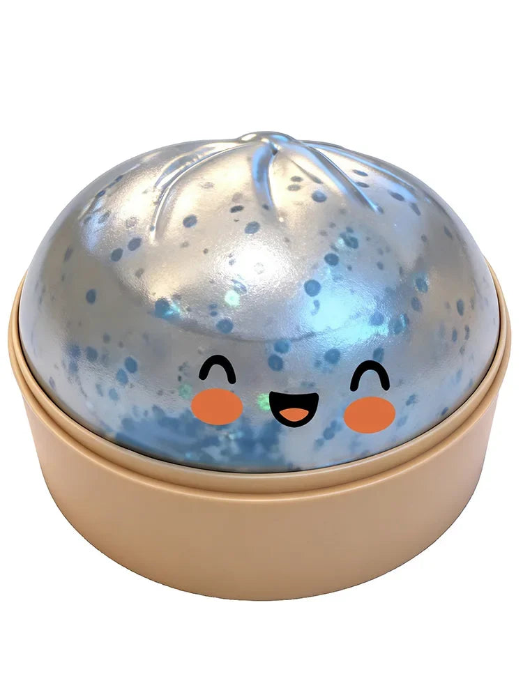 A round, shiny silver squishy toy shaped like a dumpling with cute orange facial features.