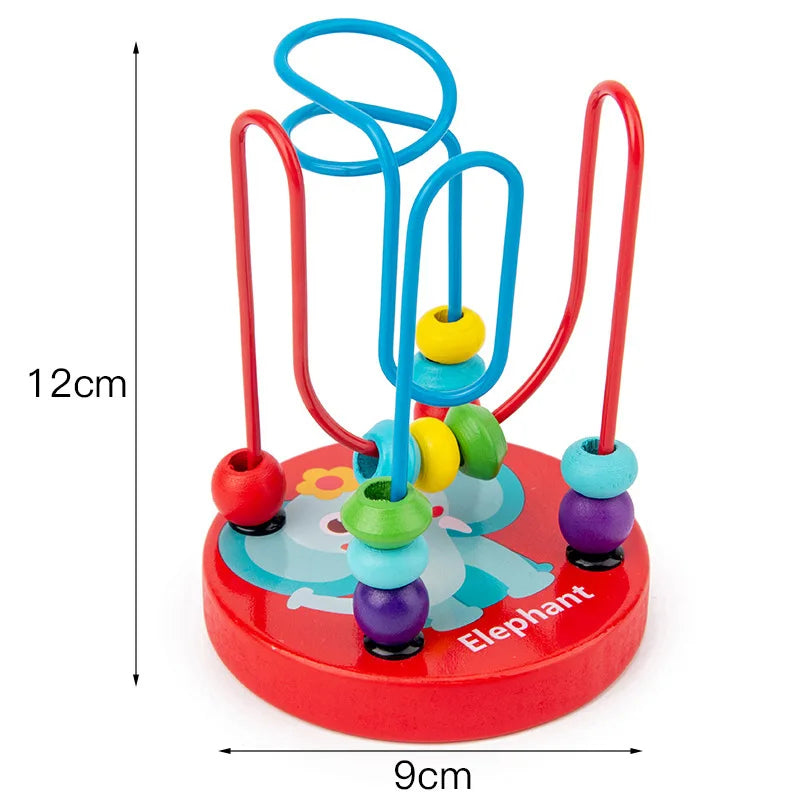 Red wooden sensory blocks shaped like an elephant with blue and yellow rings and red handles.