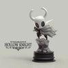 A handcrafted PVC figure of the Hollow Knight Little Knight collectible statue standing on a base.