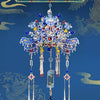 A detailed, ornate Phoenix coronet model kit featuring blue and silver metalwork, displayed against a dark blue background.