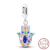 Sterling silver charm beads set featuring cross, angel, and evil eye designs for DIY jewelry making