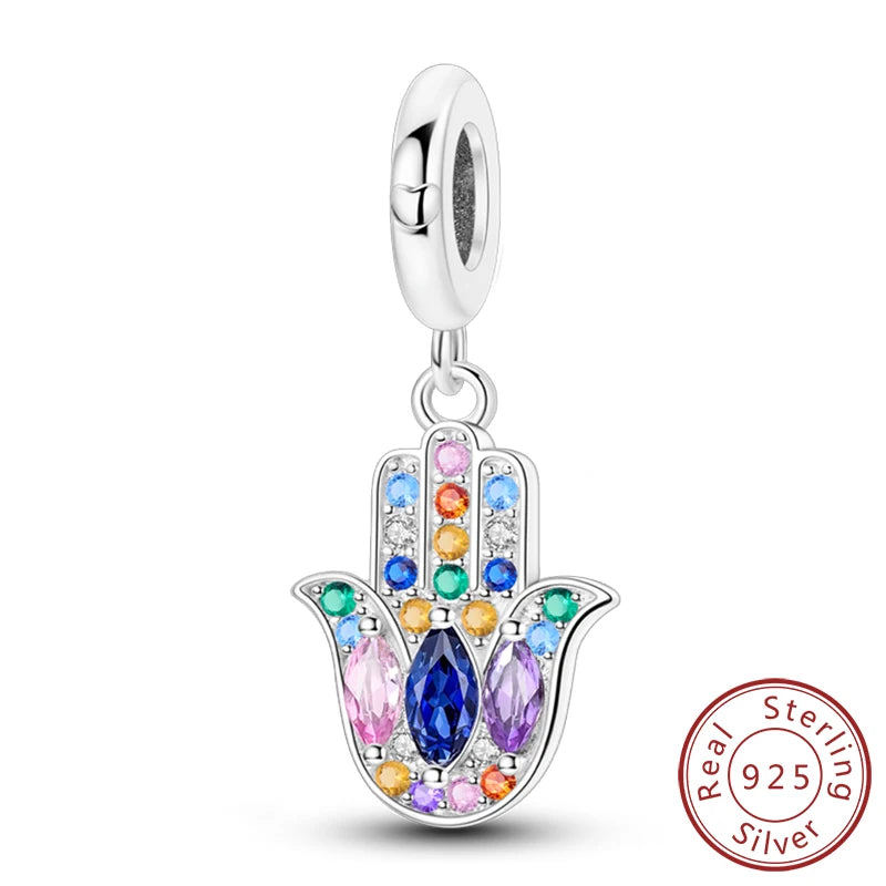 Sterling silver charm beads set featuring cross, angel, and evil eye designs for DIY jewelry making