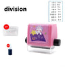 A pink math roller stamp with division problems printed on it, next to a clear plastic container and a blue stamp.