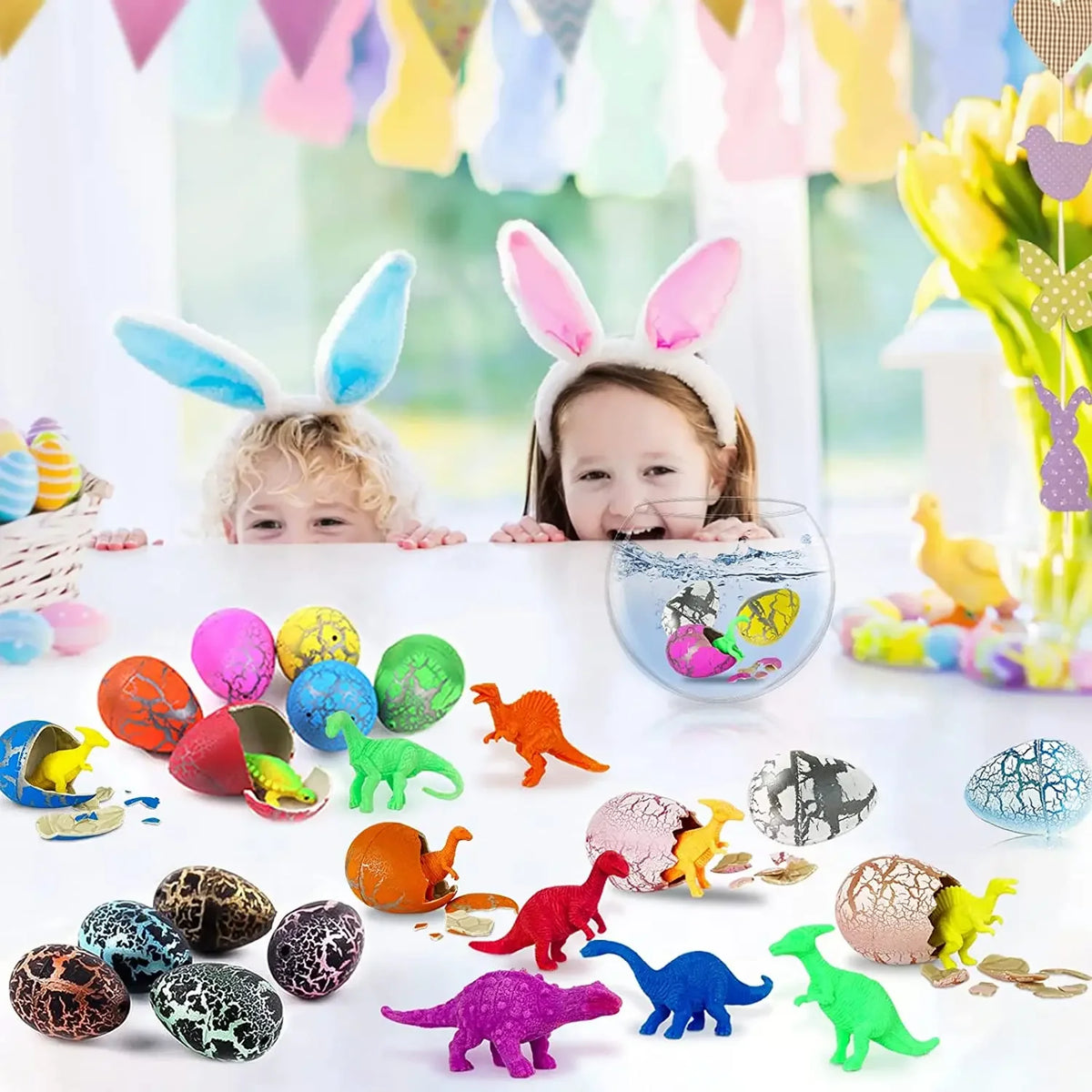 A collection of colorful dinosaur eggs and toys displayed on a white surface.