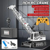 A remote control truck crane is shown with a hydraulic arm, battery, and charging cable.