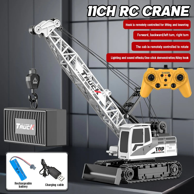 A remote control truck crane is shown with a hydraulic arm, battery, and charging cable.