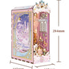 A pink wooden puzzle kit resembling a castle with a detailed interior scene and decorative elements.