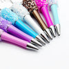 A collection of twelve colorful bead ballpoint pens featuring glitter and sequins in various shades.