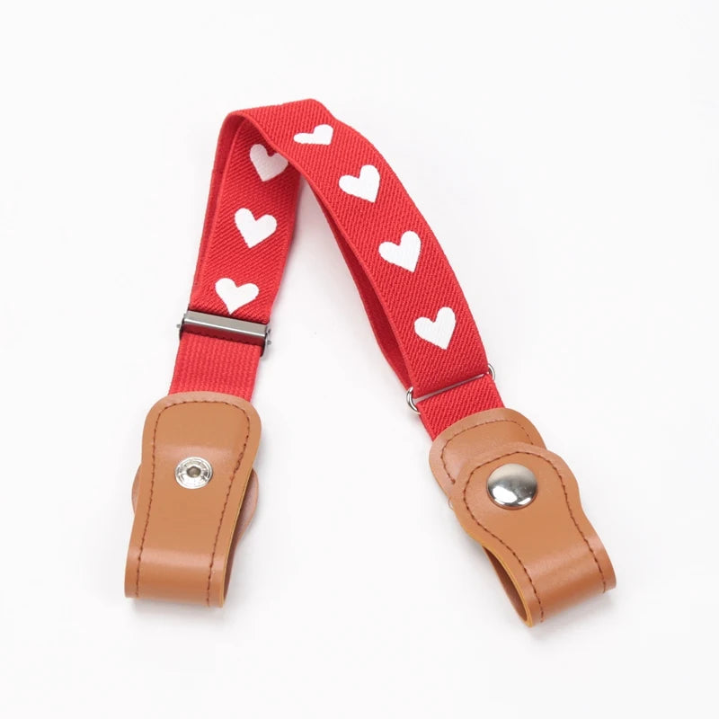 Red canvas belt with white heart pattern and brown leather buckle