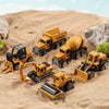 A set of six yellow and black alloy diecast construction trucks driving across a sandy landscape.