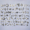 A collection of mixed metal charms for DIY jewelry making featuring various shapes and symbols.