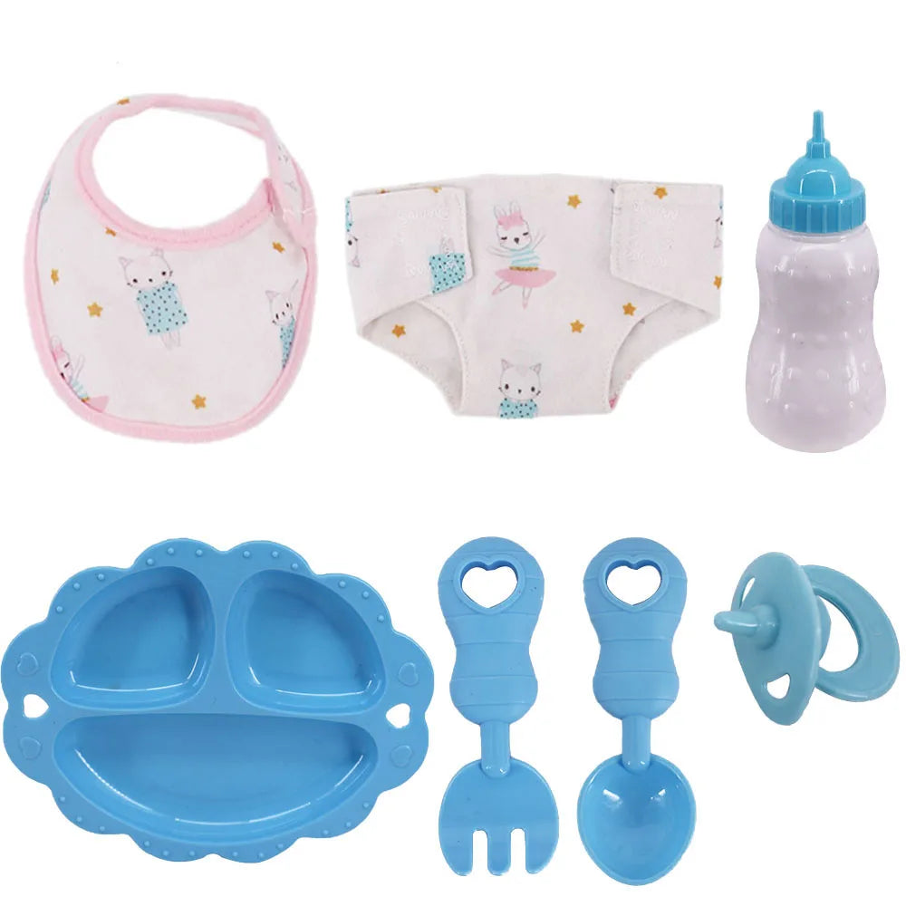 A set of doll feeding and care accessories including a bib, diaper, and silicone feeding spoons.