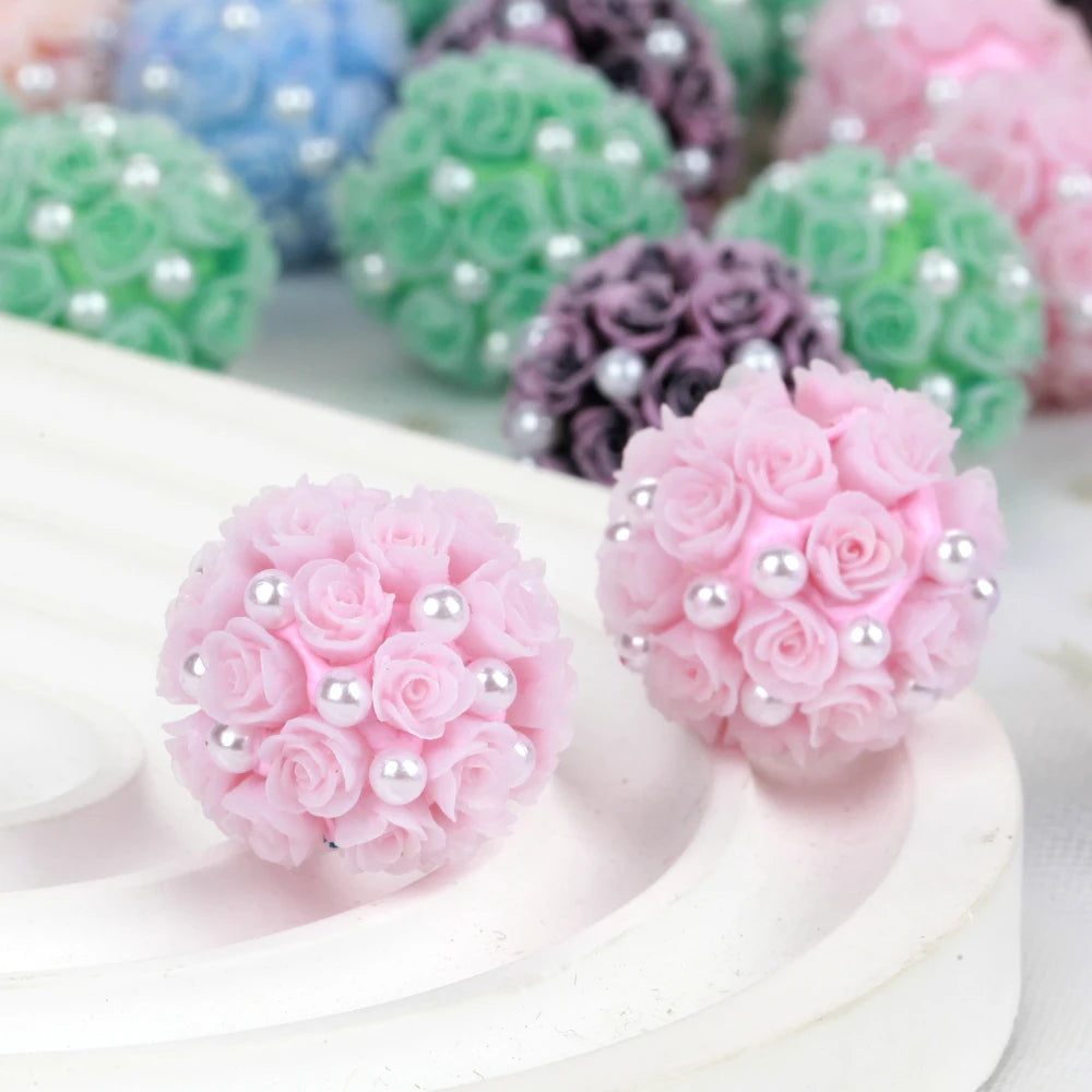 Pink rose flower ball acrylic beads for jewelry making displayed on a white surface