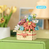 A collection of colorful DIY flower building blocks in various shades of pink, green, and blue arranged in a wooden basket.