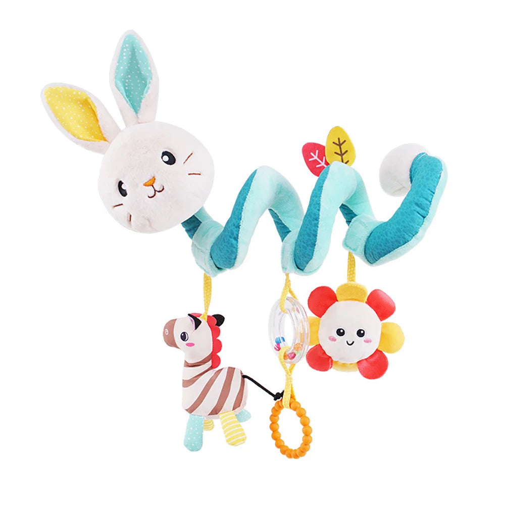 A spiral elephant sensory toy with soft fabric ears and a yellow flower attached.