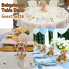A classic 14 inch plush teddy bear is shown as a guest gift for a baby shower table decor.