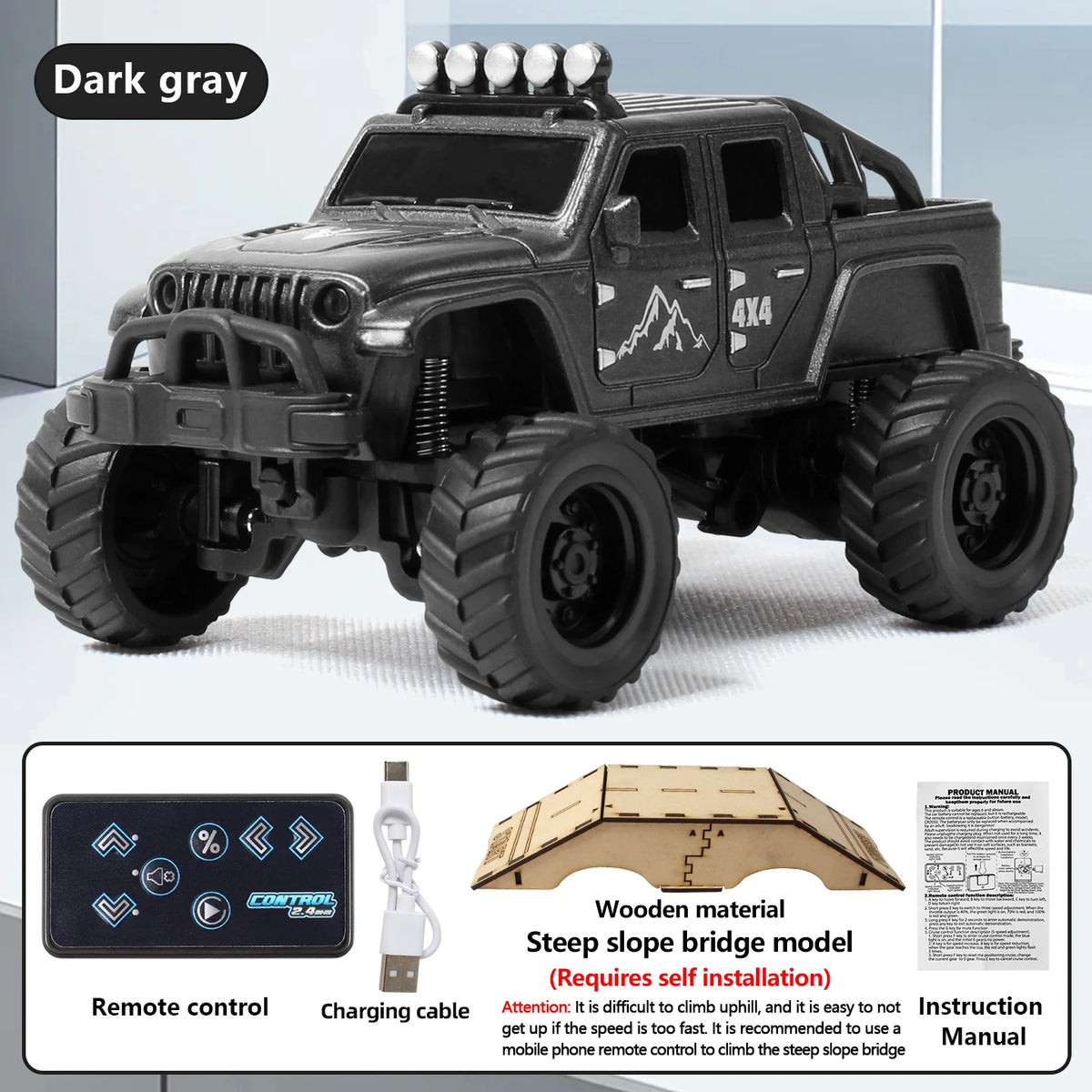 A dark gray 1:64 scale off-road RC car model with 4x4 features and remote control accessories.