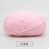 A ball of pink pre-dyed milk cotton yarn used for knitting and crochet.