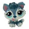 A cute, stylized pet figurine featuring a blue and white dog face with large eyes and pink accents.