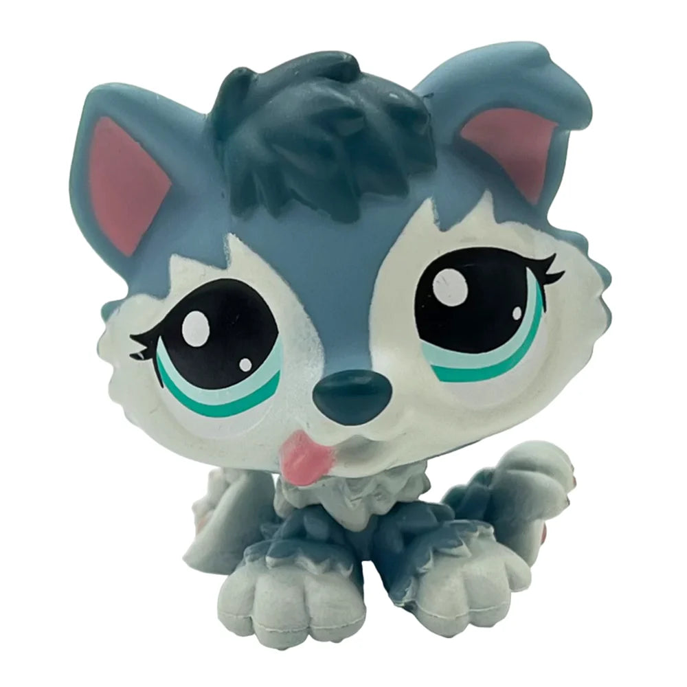 A cute, stylized pet figurine featuring a blue and white dog face with large eyes and pink accents.