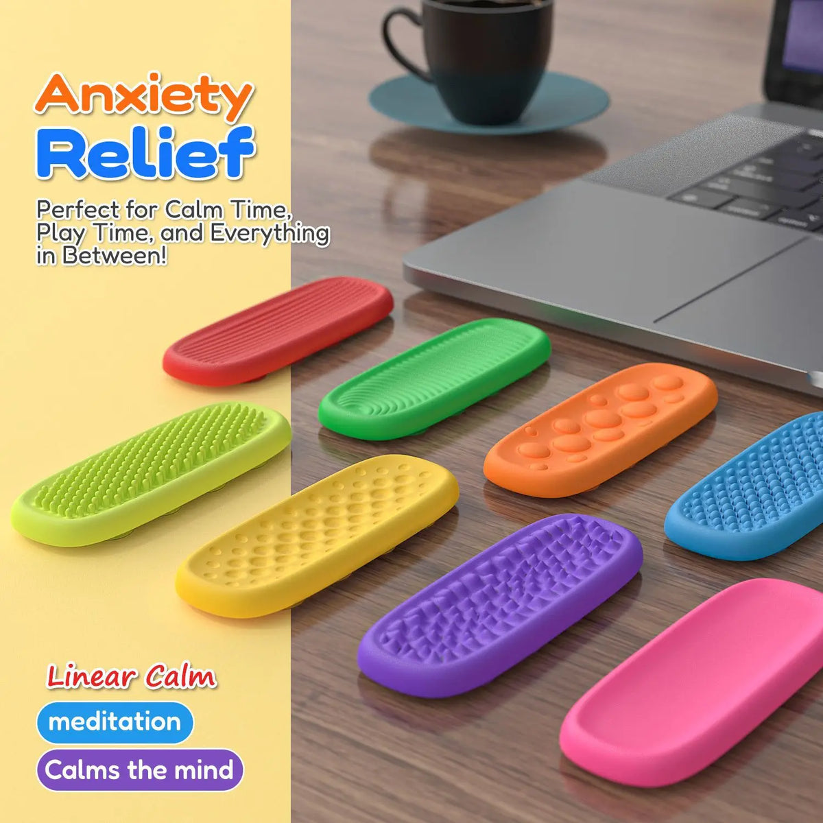 A collection of colorful silicone fidget strips for anxiety relief and meditation, laid out on a wooden desk.