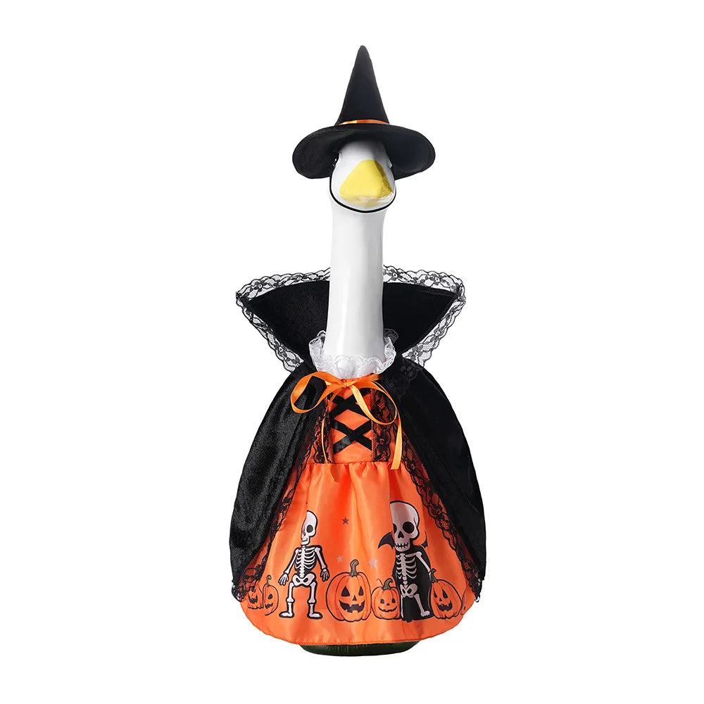 A decorative porch goose with a black witch hat and seasonal orange and black Halloween decor
