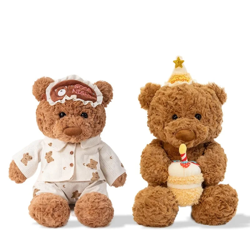 A fluffy brown teddy bear plush toy wearing an eye mask and holding a birthday cake.