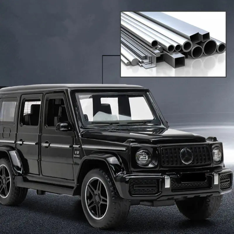 A black diecast metal RV camper truck model is shown in a side view against a dark background.
