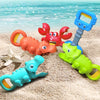 A set of colorful beach toys including a red crab, a blue dinosaur, and a green dinosaur with claw pliers.