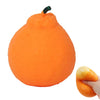 An orange stress ball with a green stem, designed for anxiety relief.