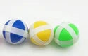 Three colorful sticky balls—blue, yellow, and green—used in a dart board game for toddlers.