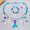 A set of five mermaid pearl jewelry pieces including a necklace, bracelet, and earrings in shades of blue, purple, and white.
