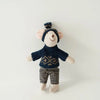 A handmade mouse plush doll wearing a navy knitted top and checkered pants.