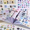 An open book filled with retro aesthetic stickers for DIY crafting, featuring various colorful and patterned stickers.