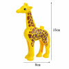 A yellow giraffe building block set with brown markings, shown in profile.