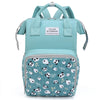 A teal mommy backpack with a light blue patterned fabric and gray straps.