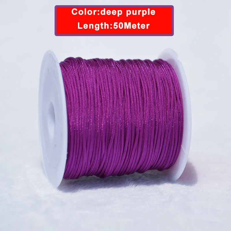 A spool of deep purple nylon knotting cord for jewelry making, 50 meters long.
