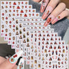 A hand displays vintage angel and saint nail art stickers featuring cherubs and crosses on a clear nail design.