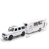 White diecast metal RV camper truck model with sound and light features shown from the side.