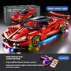 A red die-cast model of a sports car is displayed next to its box, highlighting its static version light feature.