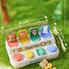 A surprise box containing a plastic animal toy set with various farm animals and an animal world theme for toddlers.
