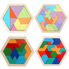 Four wooden tangram puzzle boards showing various geometric shapes and colors.