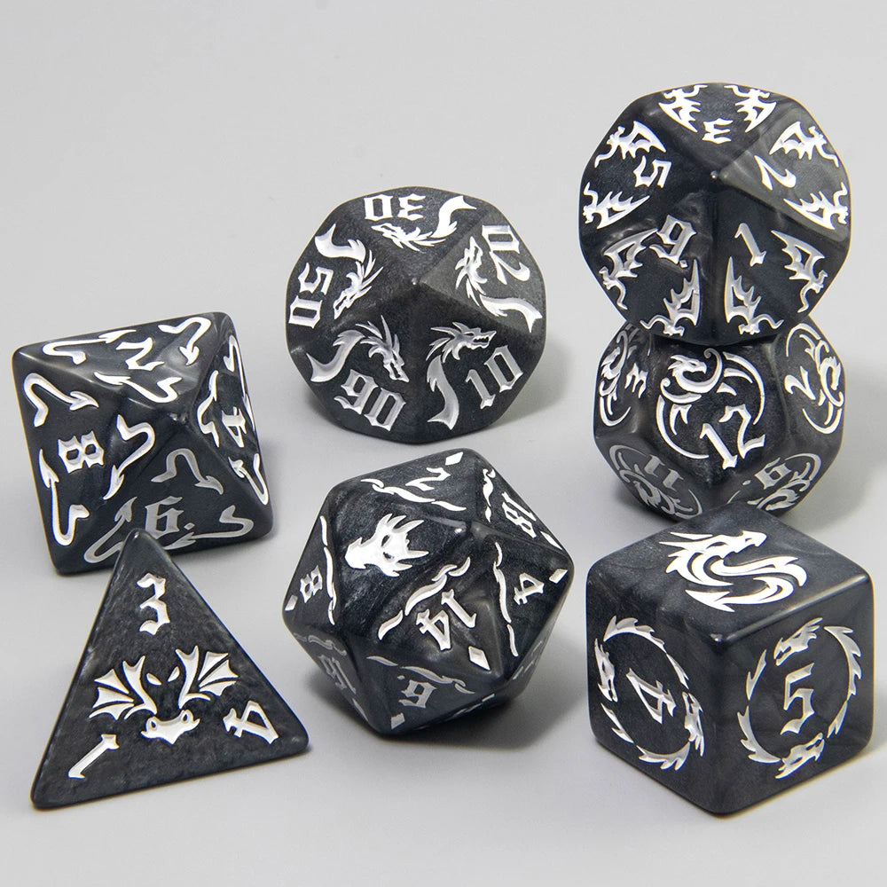 A set of polyhedral dice featuring a marble dragon pattern in black and white on a gray background.
