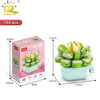 A set of 153 flower succulent building blocks in various shades of green and yellow, packaged in a pink box.
